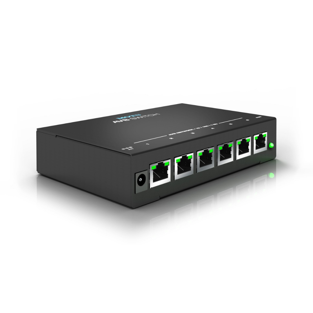MOTU AVB Switch front angle view showing 5 Gigabit RJ45 Ethernet ports and green activity LEDs for AVB audio networking