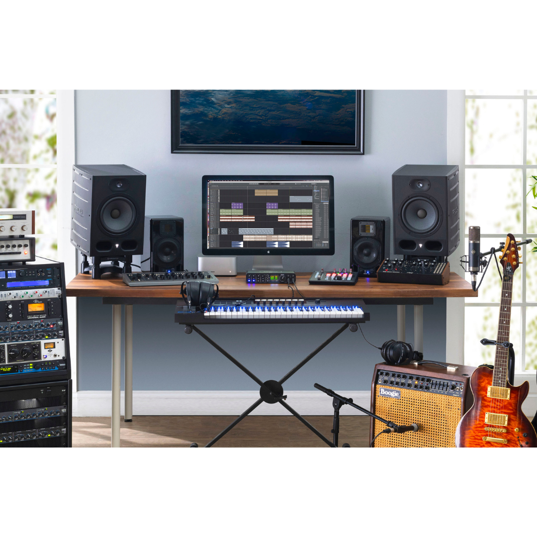 MOTU M6 Audio Interface in full studio setup with studio monitors, MIDI keyboard, guitar, rack gear and DAW screen